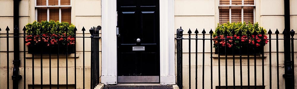 black-front-door-between-front-fence-jpg