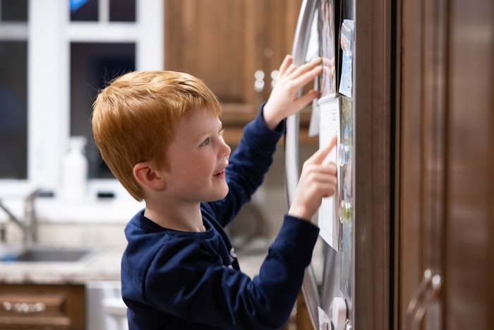 child-pointing-to-fridge-calendar-jpg