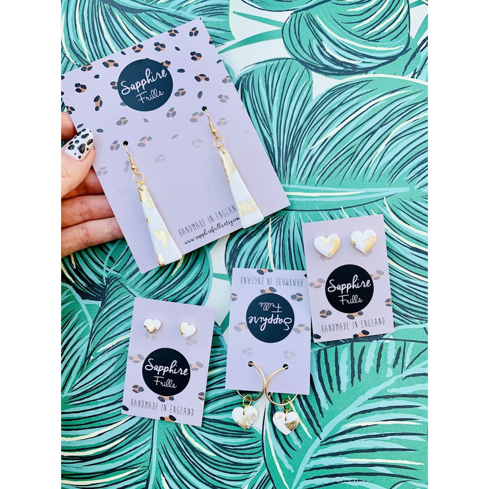 Sapphire Frills Mini White And Gold Heart Stud Earrings