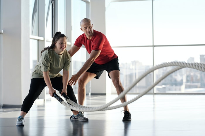 young-girl-working-out-with-trainer-jpg