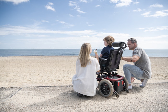 boy-with-parents-at-beach-jpg